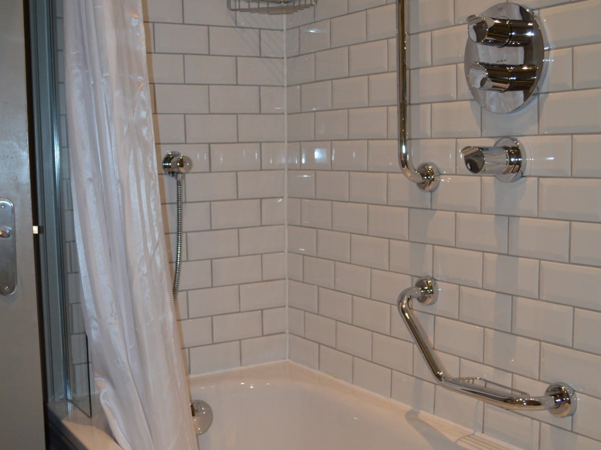 Bevel white metro tiles used inside a disability friendly shower