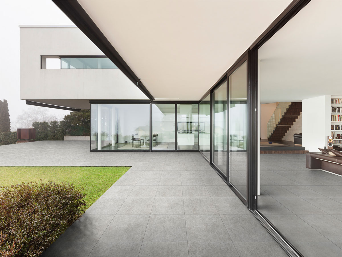 modern designer patio, with bi folding doors and a tiled patio