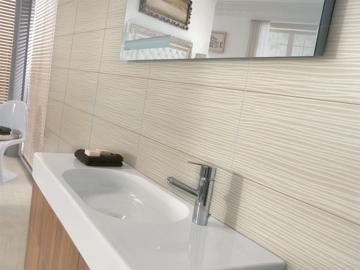 decorative tiled wall in bathroom with a basin & unit