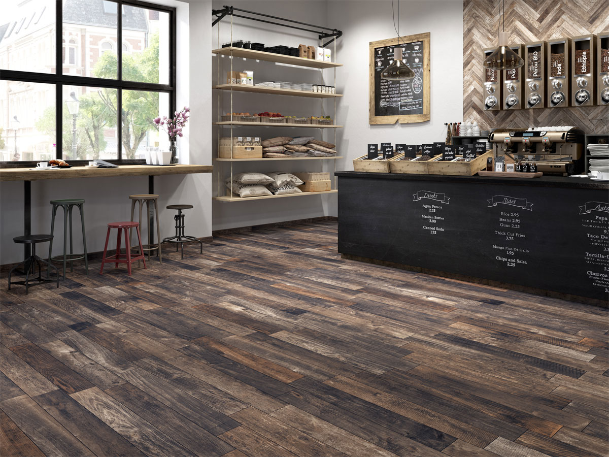 rustic feeling coffee shop with a dark coloured wood effect tiled floor