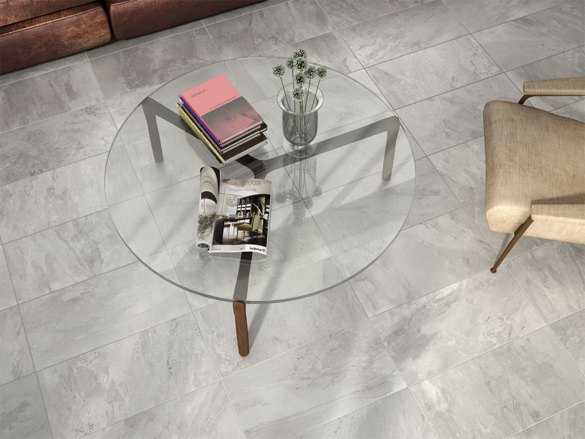 tiled waiting room with a glass coffee table