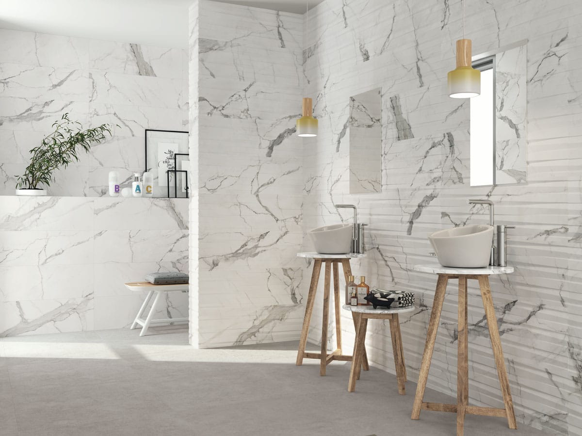 matt marble effect wall tiles and decor tiles in a modern bathroom