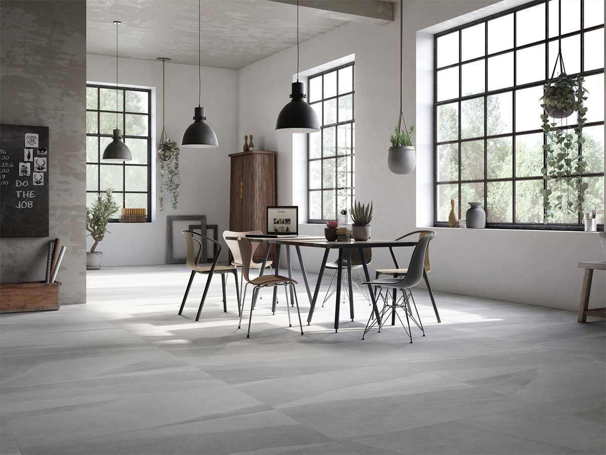 large dinning area with tiled floor and large barred windows