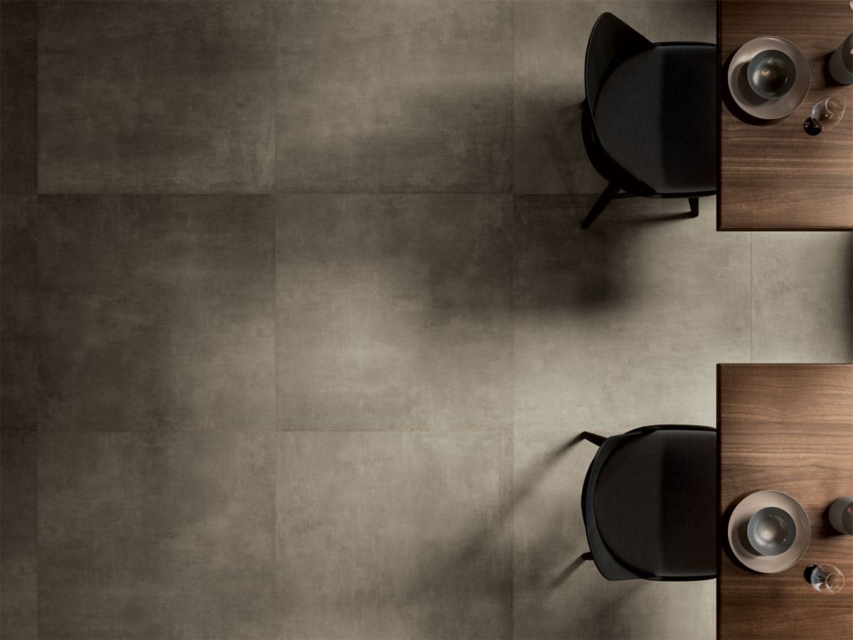 beautiful tiled restaurant floor with two tables and set places