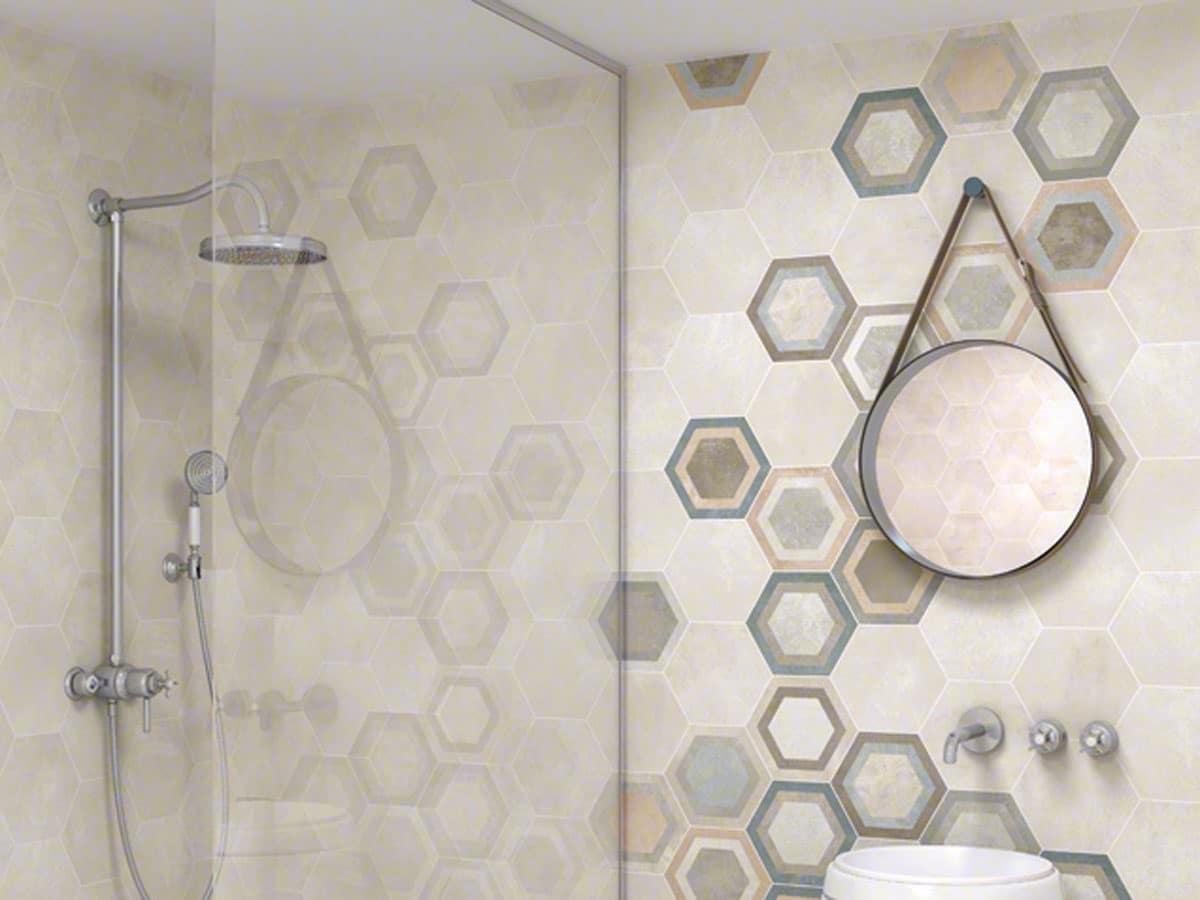 mixture of patterned and plain hexagon wall tiles in a modern shower room setting